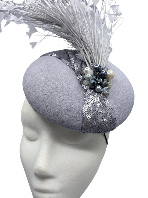Stunning grey/silver/pewter headpiece with a beautiful spray of feathers to the back. 